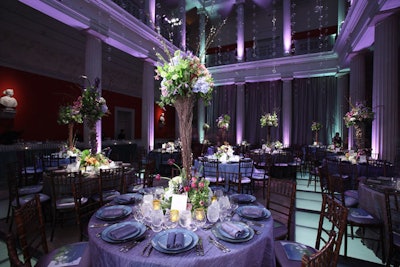Floral centerpieces in the Atrium were set on seemingly teetering bases of wood fragments and branches.
