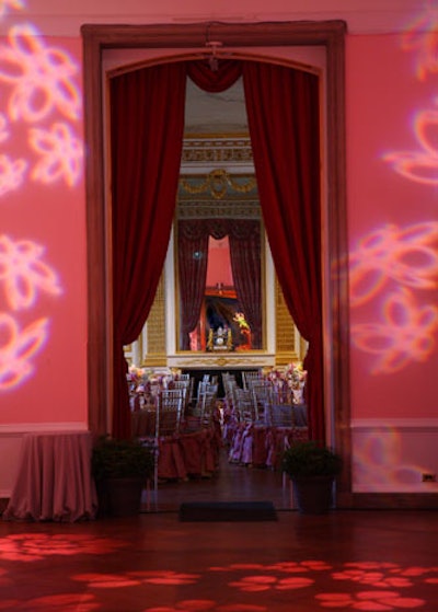 One bar area with flowery pink gobos looked into the ornate Salon d'Ore, which featured more pink linens, lighting, and flowers.