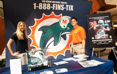 Miami Dolphins representatives sold tickets to the upcoming games.