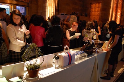A silent auction at the Food Allergy Initiative's daytime event included items such as a Tory Burch package and an Equinox Fitness membership.