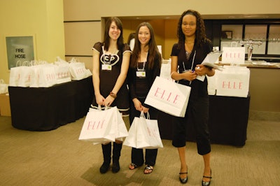 Volunteers handed out Elle gift bags at the entrance to the show, held at the Carlu.