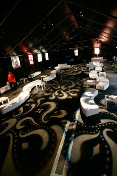 An ornate gobo pattern concealed the painted stripes on the parking lot where the tented after-party took place.