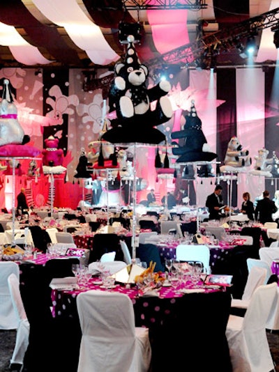 Oversize teddy bears—in black, pink, and silver—topped risers on tables throughout the ballroom, which organizers draped with panels of fabric.