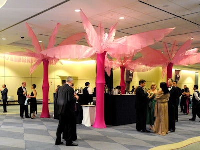 Pink spandex palm trees, crafted by Luis de Castro, added to the decor in the reception area.