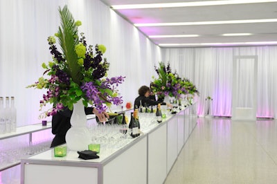 Purple and green floral arrangements from San Remo Florist topped the bar in the reception area.