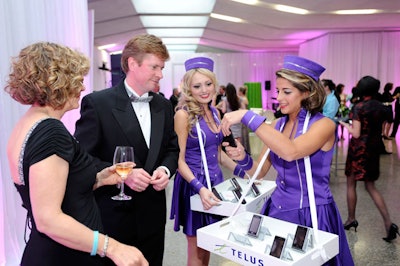 Models dressed as cigarette girls took photos of guests with LG Dare phones.