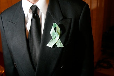 Guests who entered the Discovery raffle sported green ribbons.