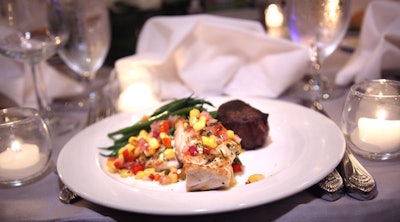 Omni Shoreham chefs prepared the main course of pan-seared grouper and beef tenderloin.