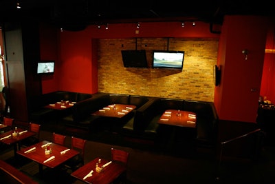 Two of the nine-person booths in the main room can be covered to provide a stage for entertainment.