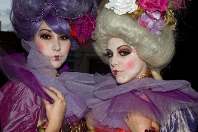 BG Entertainment models in white makeup and tall white wigs posed for pictures throughout the night.