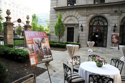The Week staffers placed blow-ups of recent magazine covers as well as signage depicting a sponsor's ad campaign along the border of Astor Terrace, where bartenders served cocktails.