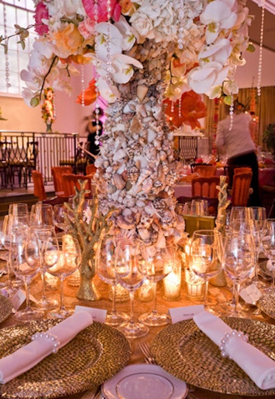 Chestnuts in the Tuileries used a giant vase covered in seashells, fashioned napkin rings from strands of pearls, and completed the look with golden coral sculptures.