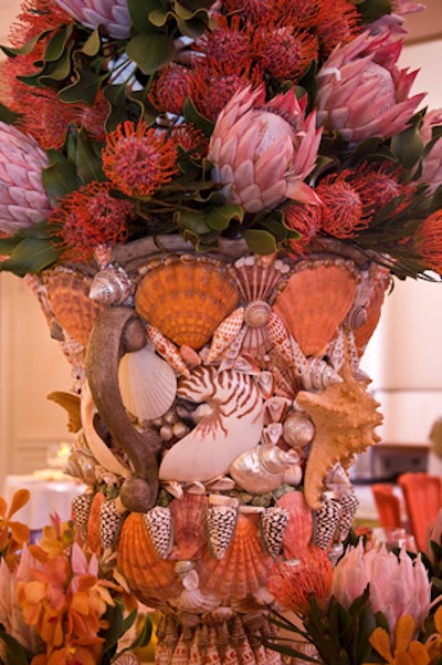 Interior designer Scott Snyder went for a beachy look, with a shell-printed tablecloth, a seashell-encrusted urn, and beach towels with shell ornaments on each chair.