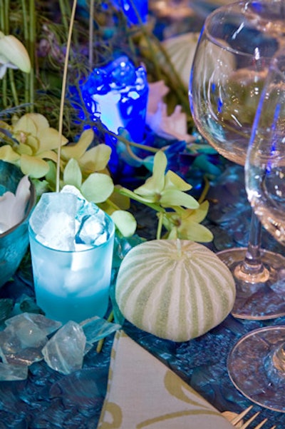 Bowman Dahl had an ocean-inspired look, with a crinkly blue table linen, beach glass, candles shaped like sea urchin shells, and fish-shaped sculptures fashioned from palm fronds.