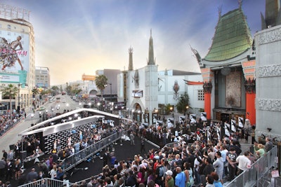 Crowds watched as actors posed in front of the delta-shaped step-and-repeat.