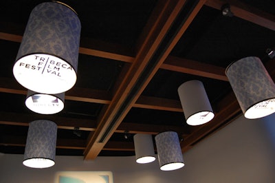 DirecTV and the Tribeca Film Festival logos appear in the bottom of the lampshades that hang from the ceiling of the press center.