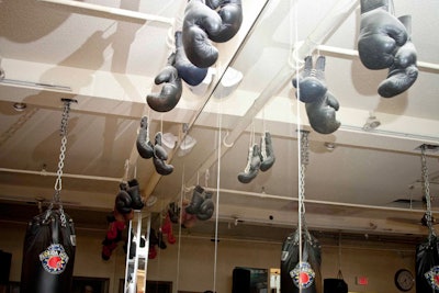 Boxing gloves hung from the rafters throughout the gym.