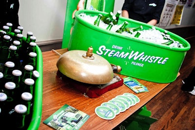 Green buckets held bottles of Steam Whistle beer at a display sponsored by the brewery.