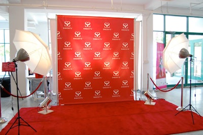Guests could have their picture taken for Shecky's Web site at the step-and-repeat created by NYC Wraps.