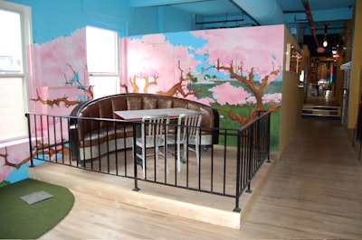 One semiprivate booth on the upper level overlooks the miniature golf course.