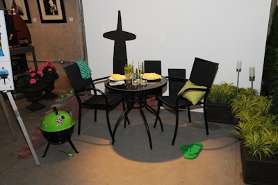 The P.C. resin wicker bistro set and a portable barbecue were featured in a display for small urban spaces.