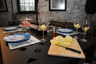 Patterned tableware and glass candleholders topped the P.C. Huntington cast aluminum patio set in the socialite setting.