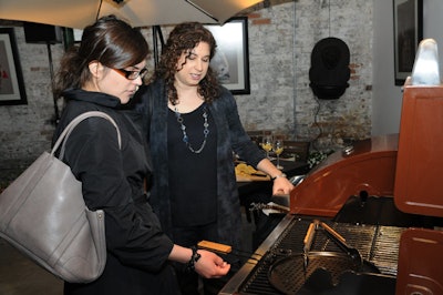 Guests had the opportunity to examine the products, which included several barbecues.