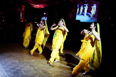 Indian dancers dressed in vibrant costumes posed and performed for guests during the cocktail party and ushered them into the ballroom for dinner.