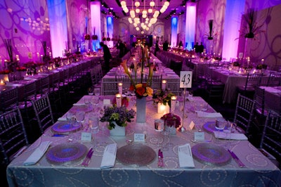 In the three dining rooms on the center's upper level, floral arrangements of pink roses, fuchsia peonies, and lilacs in square silver boxes and tall cylindrical glass vases lent a romantic air.