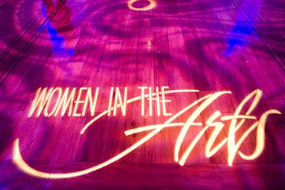 Kennedy Center technicians projected the 'Women in the Arts' logo on the dining room floor.