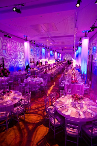 Columns made of sheer fabric hung from the ceilings in dining rooms, each illuminated in purple.