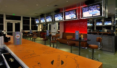 The Game On Sports Bar features nine 50-inch TVs suspended from the ceiling along two sides of the narrow venue.