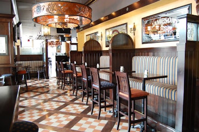 Dark wood accents, ornate light fixtures, and etched mirrors fill Watermark Irish Pub, which seats 240 inside and a further 220 on a lakefront patio.