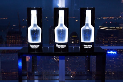 During Swizz BeatZ's performance of 'When I Step Into the Club,' darkened silhouettes of the Hennessy Black bottle began glowing.