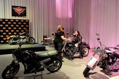 Guests could familiarize themselves with the various features offered by Harley-Davidson at a motorcycle display.