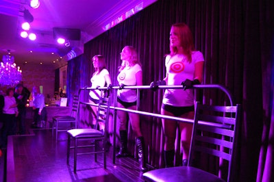 Three burlesque dancers from LaRouge Entertainment performed while wearing the new Fashion Targets Breast Cancer T-shirts.