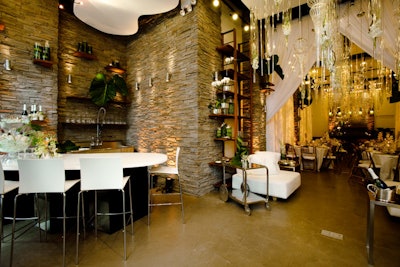 Approximately 1,500 square feet in size, the studio is one unbroken space with 14-foot-high ceilings and stone columns.