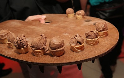 Guests pulled mini chocolate ice cream cones from perforated trays.