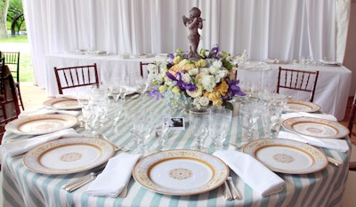 For his table arrangements, florist Jack Lucky used European-style statuary and Roman-style vessels.