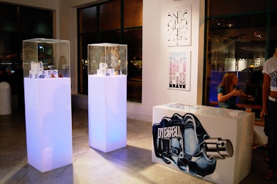 Images of the cologne's fist-shaped bottle adorned the space, including the check-in desk.