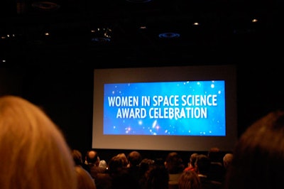 The award ceremony took place in the Universe theater, where a large projection screen broadcast slides and signage.