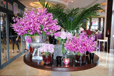 Silver and glass vases of purple flowers—inspired by a display in the lobby of the Four Seasons Hotel George V Paris—sat atop a table in the reception area.