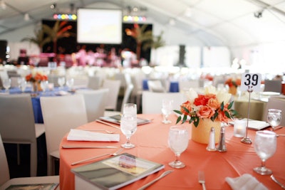 Bright linens and floral arrangements topped tables.