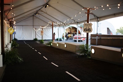 The walkway from the cocktail reception to the dining tent got the look of a freeway with signs and black-and-white carpet.