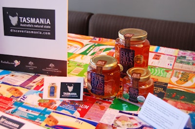Event sponsors promoted products such as Blue Hills Honey in a display area set up near the bar.