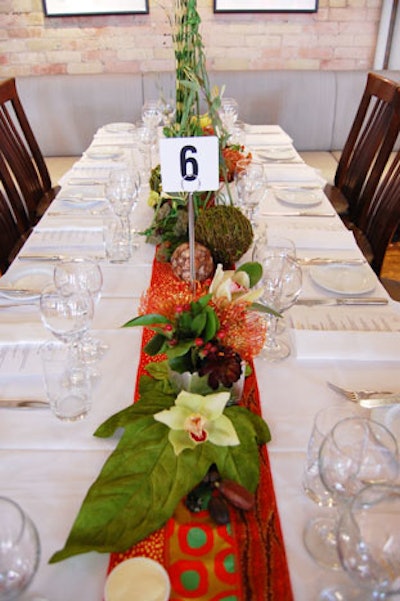 Event organizers topped tables with orchids and native Australian plants.