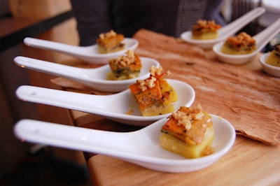 Hors d'oeuvres included a polenta-based layered herb-vegetable slice garnished with cracked roasted madadamia nuts.