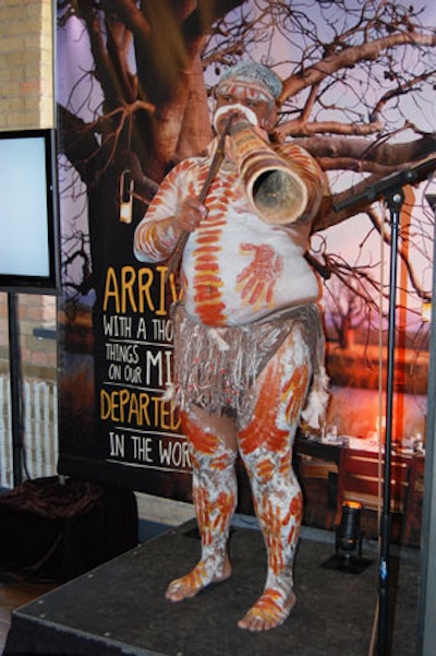 A man painted with traditional markings played a didgeridoo to signal the start of the luncheon.