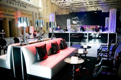 Bill Fulghum filled the reception area with silver couches, black sequined pillows, and mirror-topped tables from Contemporary Furniture Rentals.