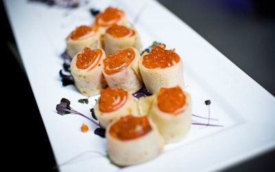 Servers passed hors d'oeuvres including smoked salmon wraps during the cocktail reception.